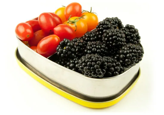 Blackberries and tomatoes in a package designed to keep food cool