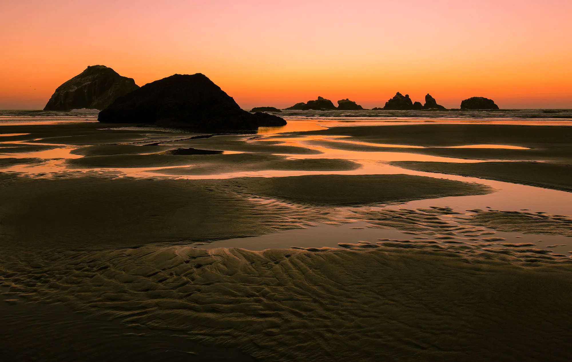 A sunset photograph of a negative tide in Bandon, Oregon