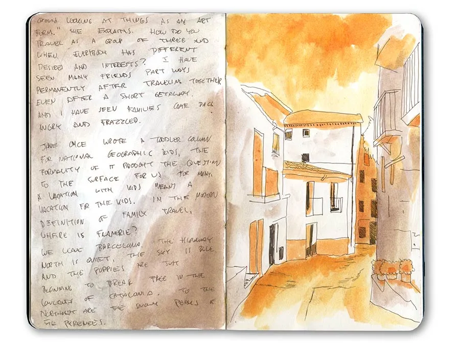 Moleskine spread with handwritten notes and an orange watercolor sketch of the whitewashed houses of Cadaqués.