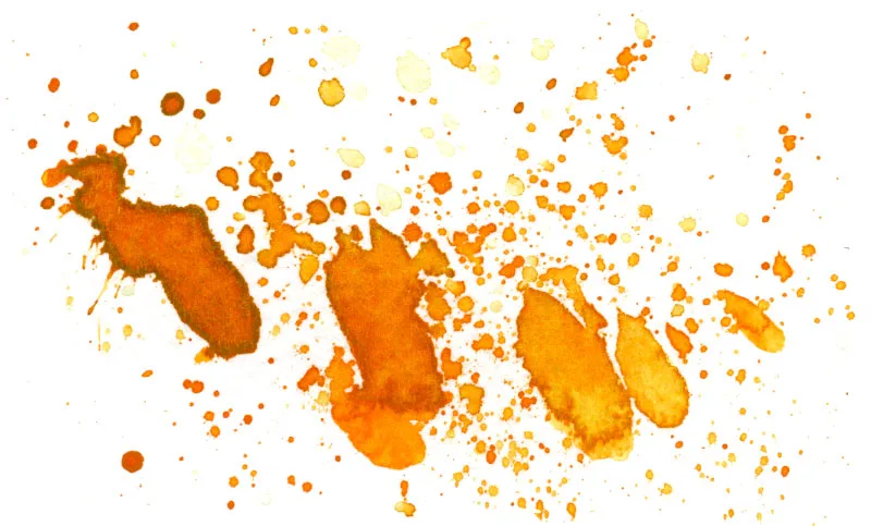 Splatters of cadmium orange watercolor paint.