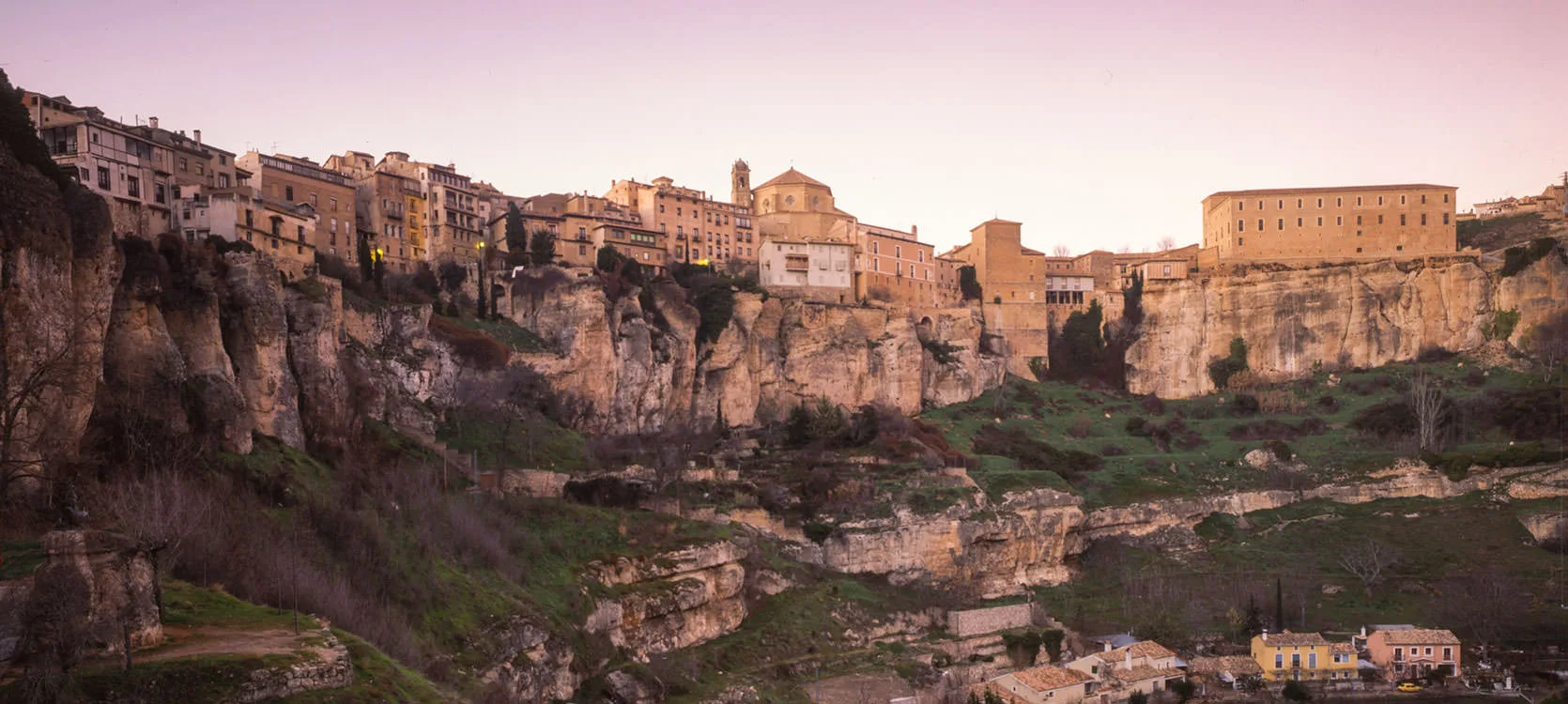 The old town of Cuenca perched on limestone cliffs at dusk, Spain