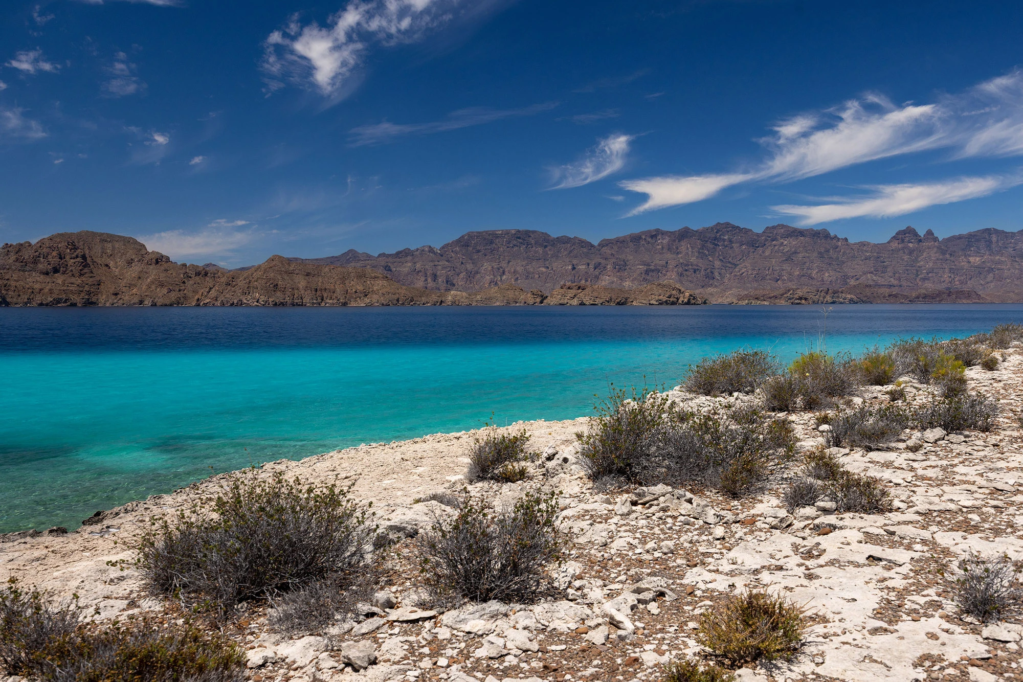 The desert coastline of Isla Carmen, Baja California Sur, dropping into the Sea of Cortez