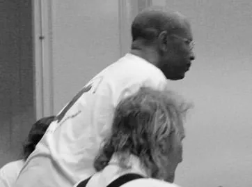 Black-and-white photo of Great Guana Cay Mayor Glenn Laing at a Save the Bahamas Coalition meeting.