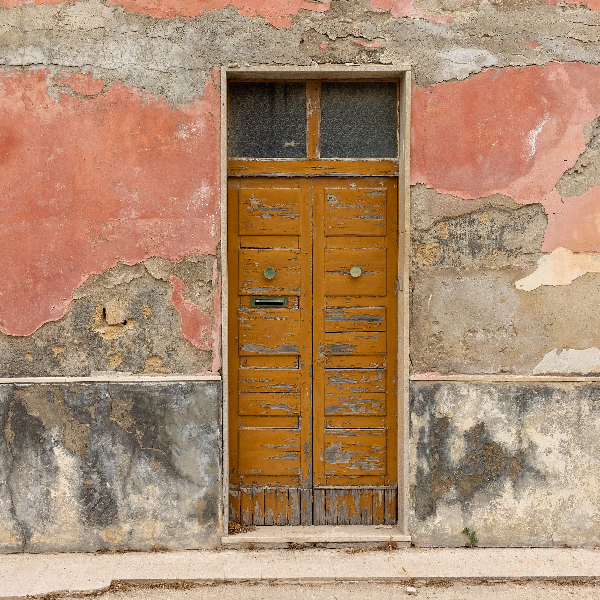 A weathered door in the back lanes of Marzamemi, Sicily.