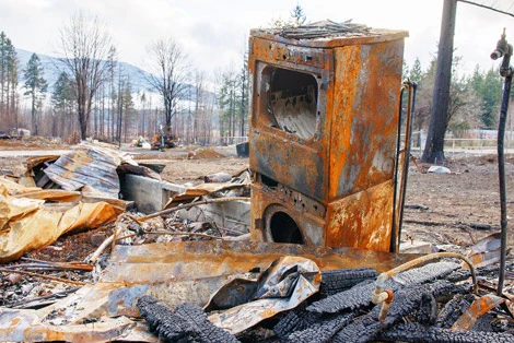 Wildfire destruction in Oregon after the 2020 Santiam Canyon fires, illustrating how extreme heat, drought, and wind intensify modern fire behavior and contradict claims that climate change is not a major driver.