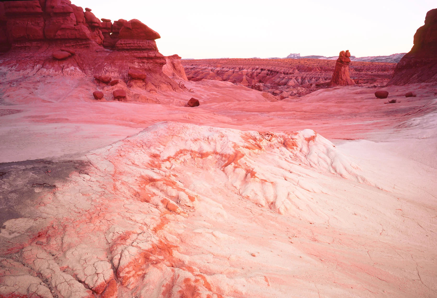 Red sandstone hoodoos and desert floor in Goblin Valley State Park, Utah