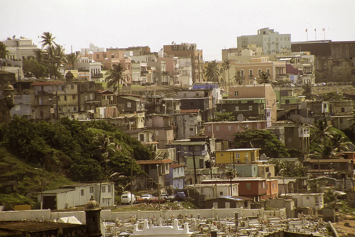 Densely packed houses climbing a hillside in San Juan, Puerto Rico.