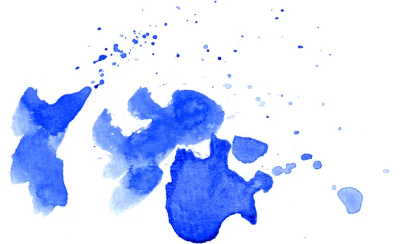 Bold blotches and spatter of ultramarine blue watercolor on white