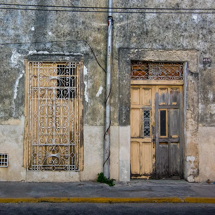 Pastel blues surround these grated windows in Mérida, Yucatán